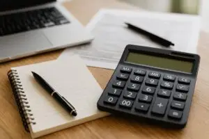 IRS payment plan Baltimore tax relief help with calculator and documents on desk