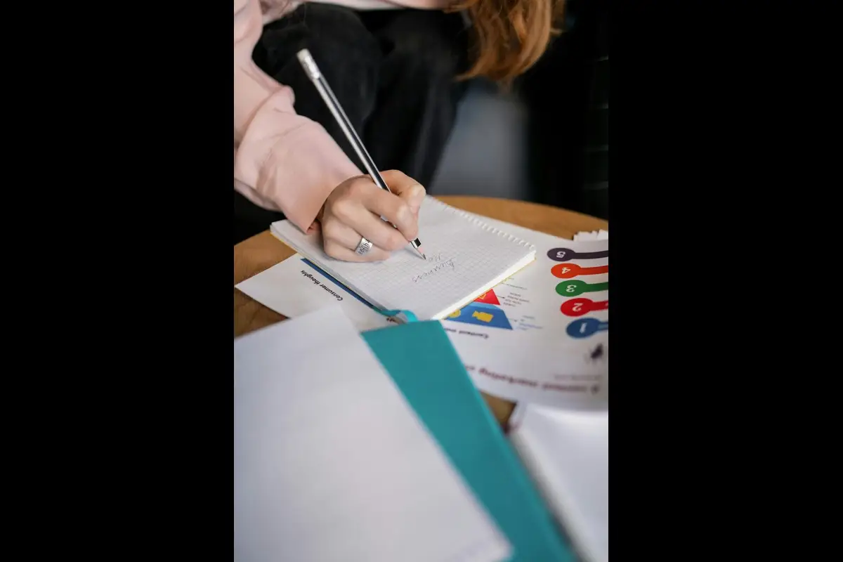 Tax professional helping a Baltimore client review IRS paperwork and discuss Currently Not Collectible (CNC) status options.